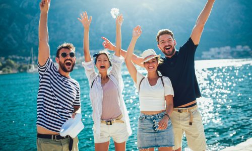 Happy group of tourists traveling and sightseeing together